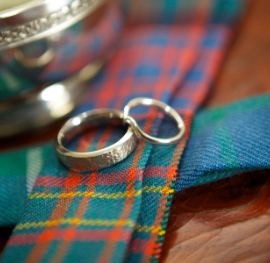 Two wedding rings on tartan